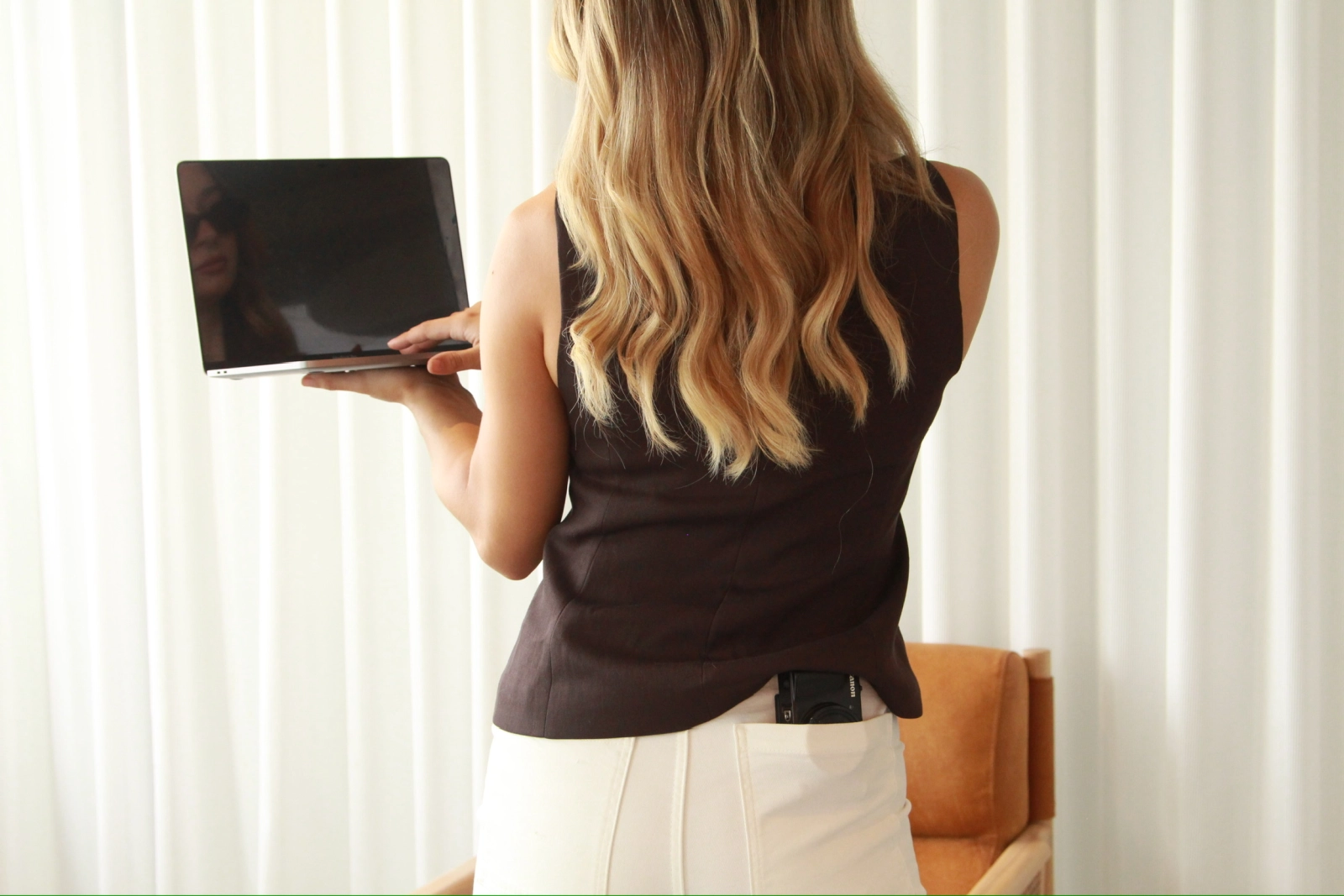 Woman planning social media content on laptop